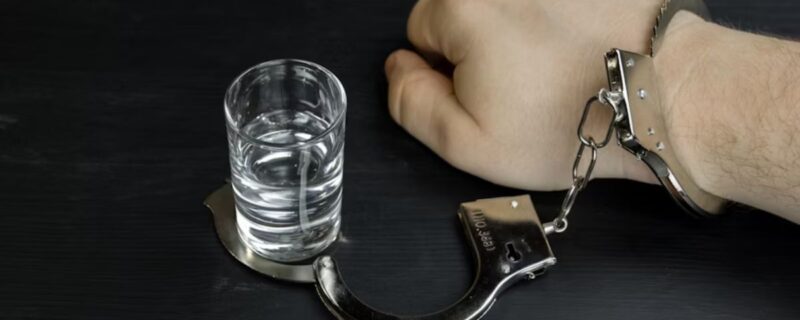 What to Expect During Alcohol Detox: A Step-by-Step Guide 1 Close-up of a man’s hand, previously handcuffed to a drink, now freed.