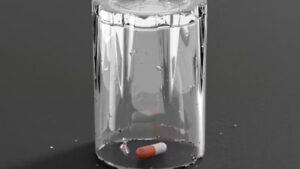 Denial About Substance Use Disorder: A single pill lies beneath an upside-down glass.