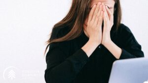 Stressed Woman Covering her Face with her Hands