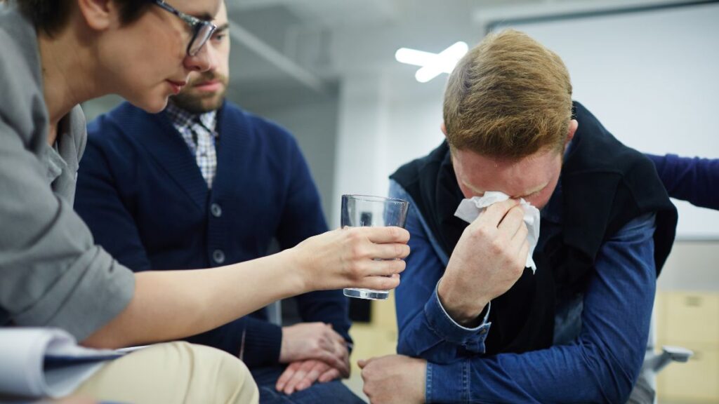 The Role of Therapy in Addiction Treatment 2 Addiction therapy, an adult expresses intense emotions during a counseling session.